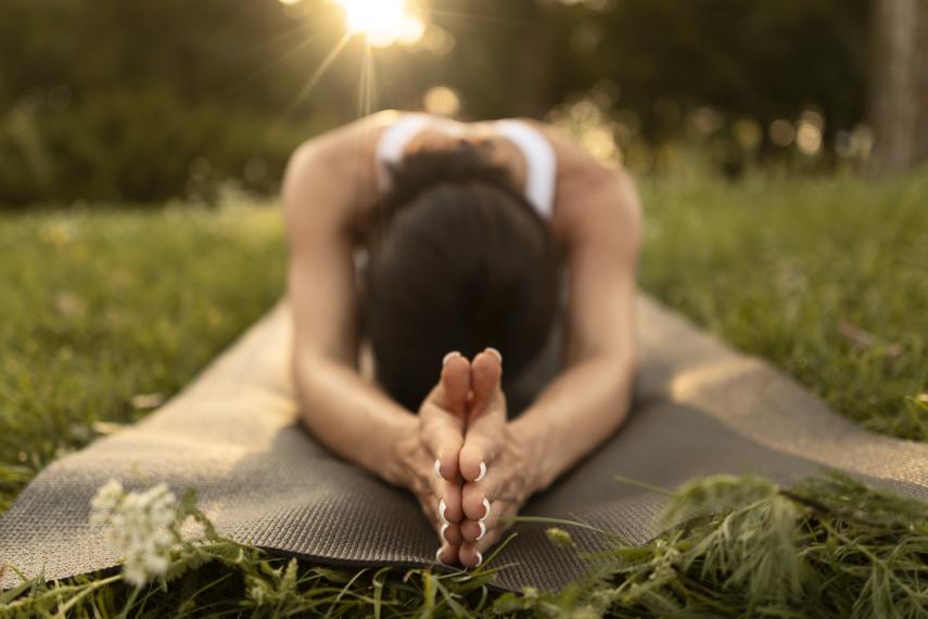 full-shot-woman-stretching-mat